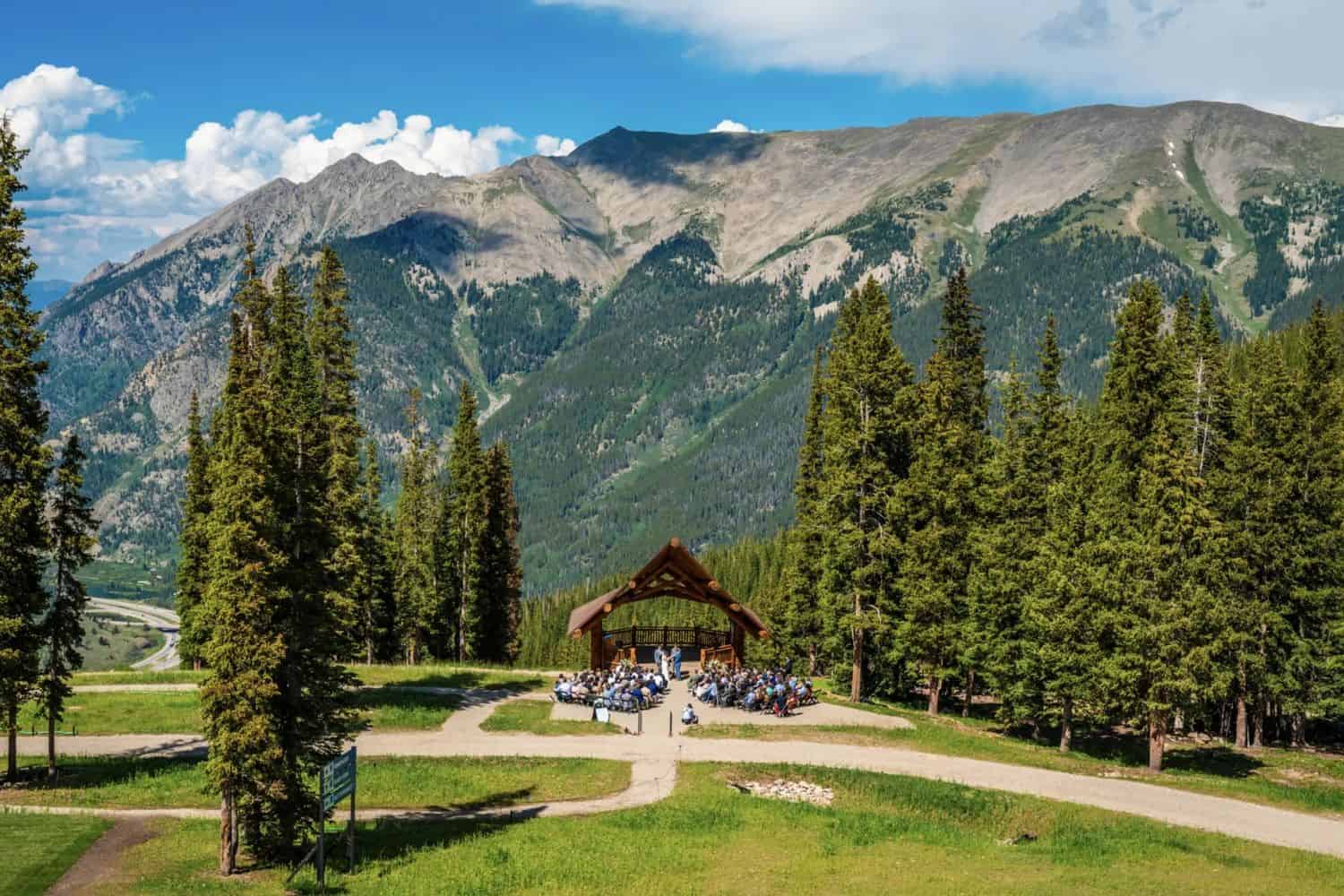 Scenic mountain landscape with outdoor stage and bikes, perfect for DJ Bertie events.